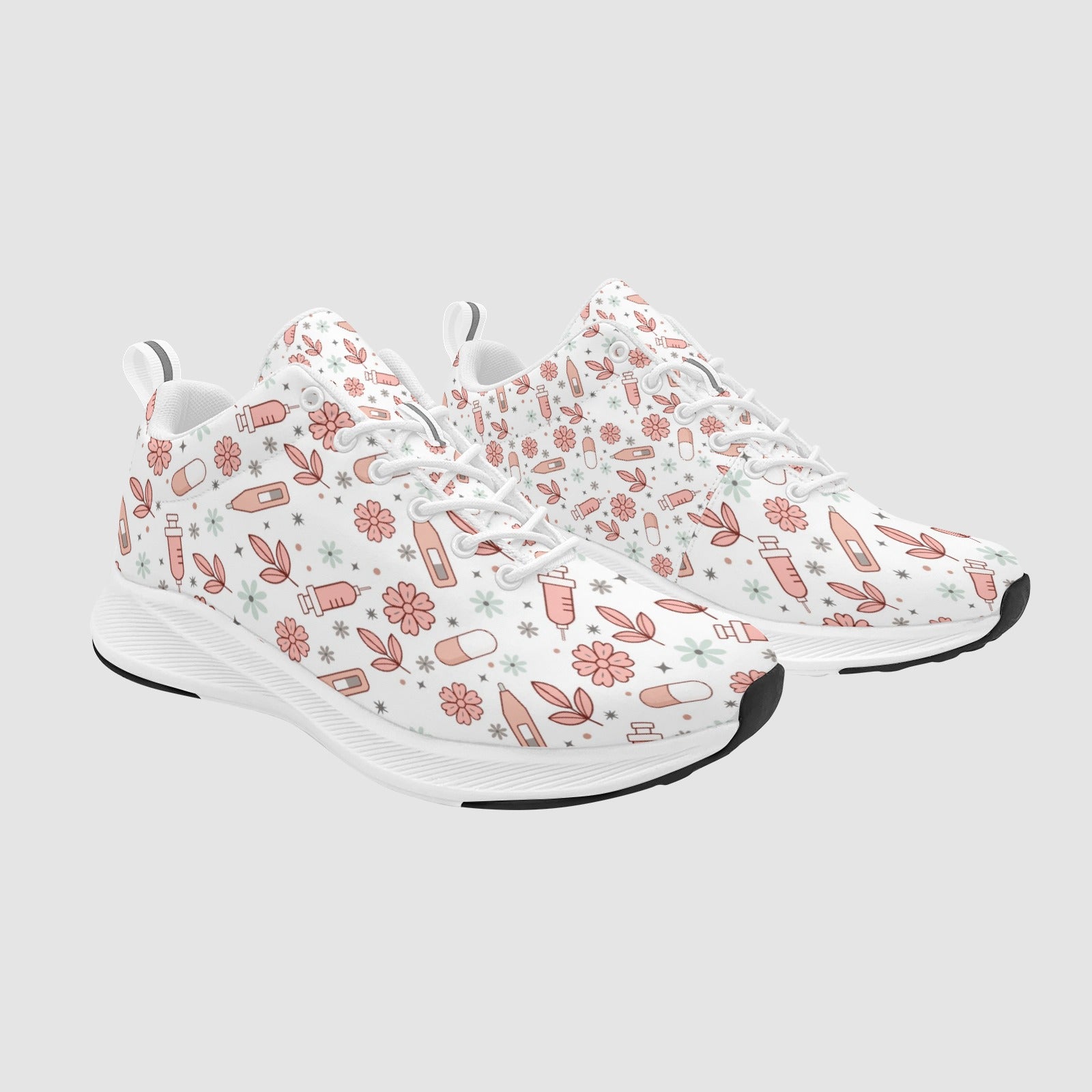 Pair of white nursing sneakers featuring a dusty-rose floral pattern with syringes, pills, and band-aids on a white background.
