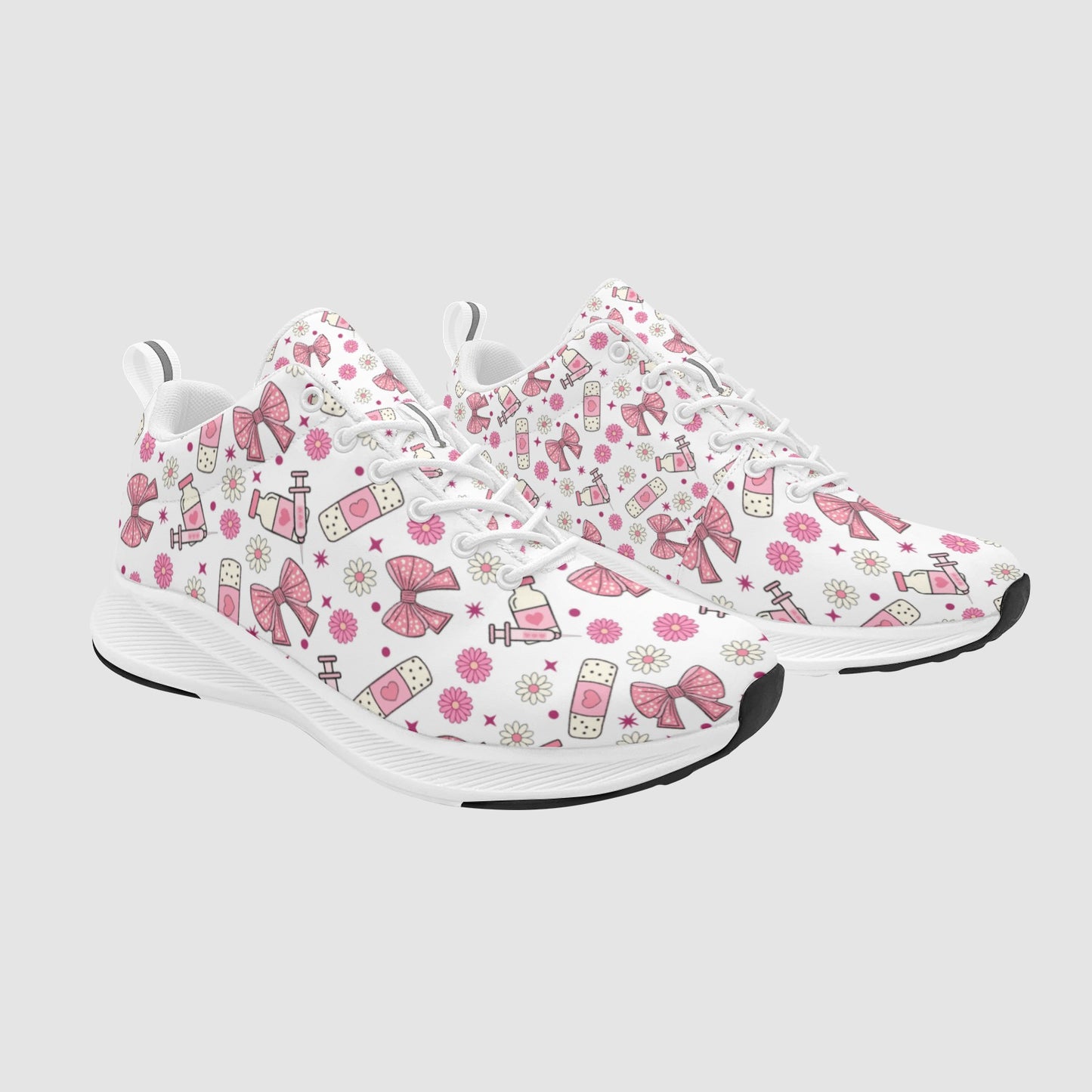 Pair of feminine nursing sneakers featuring a coquette aesthetic with pink bows, ribbon accents, and subtle medical motifs on a clean white sole.