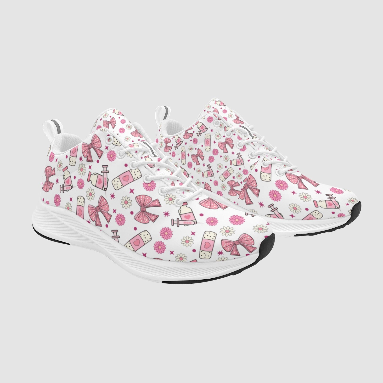 Pair of feminine nursing sneakers featuring a coquette aesthetic with pink bows, ribbon accents, and subtle medical motifs on a clean white sole.
