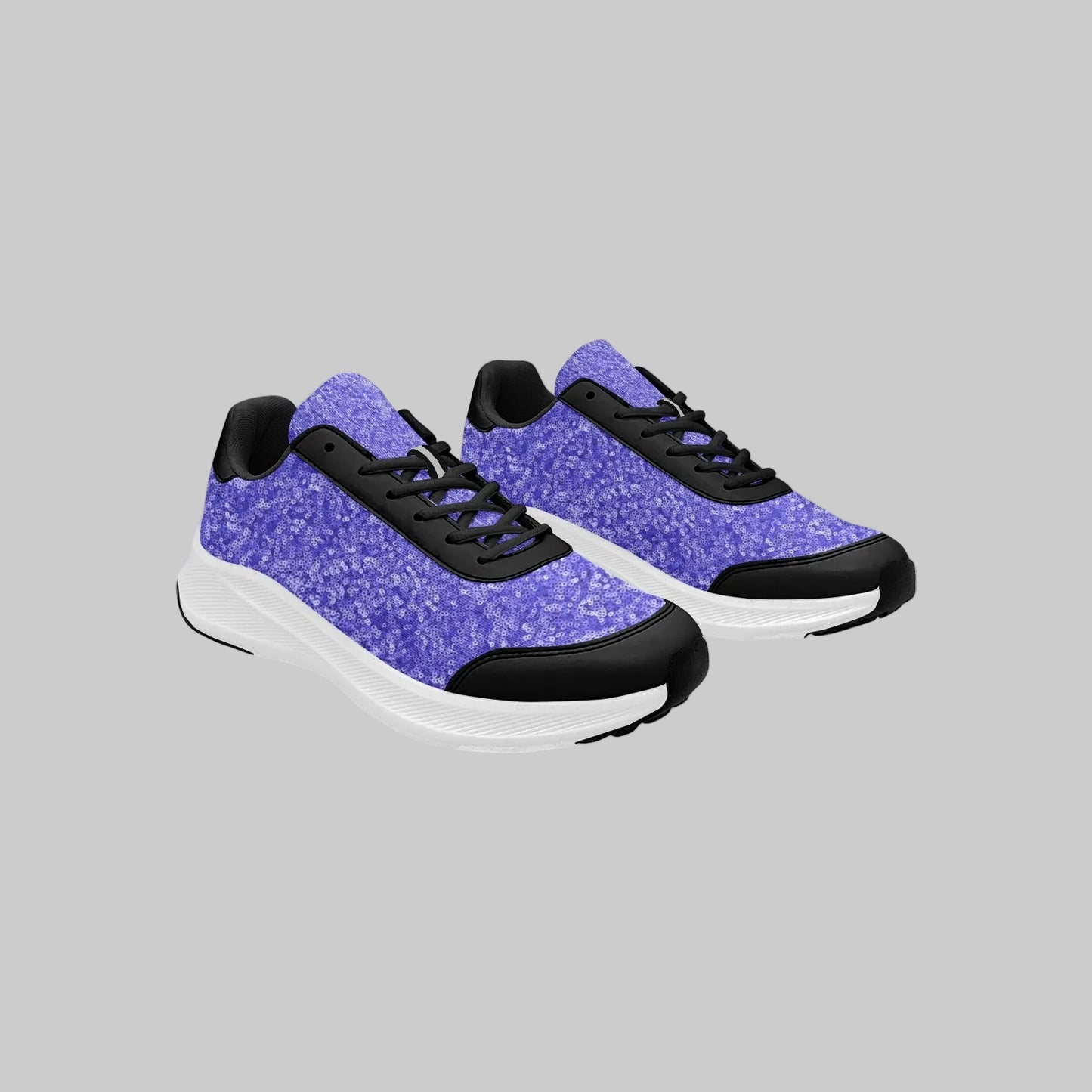 Women's Electric Orchid running shoes with vibrant purple patterned mesh uppers and black protective trim.