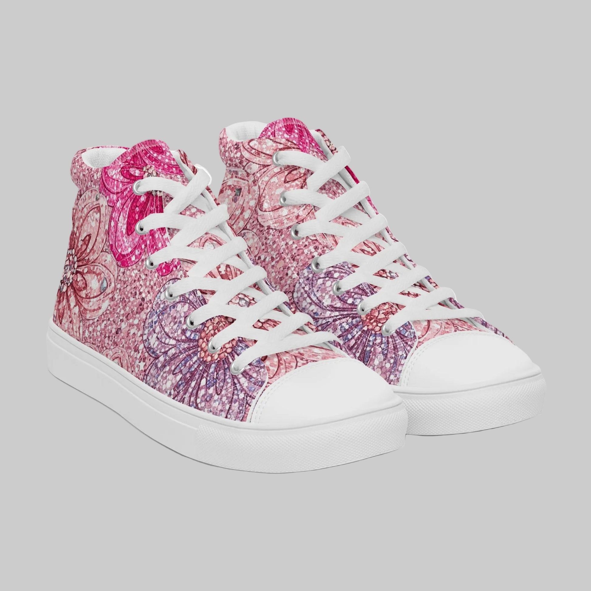 Pair of high-top canvas sneakers featuring a vibrant fuchsia, lavender, and orchid glitter floral pattern with white faux leather toe caps, white laces, and white rubber soles