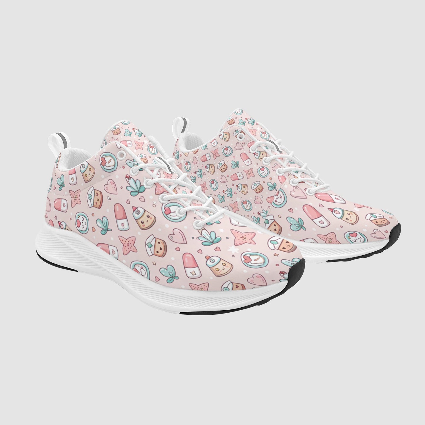 Pair of women's light pink athletic sneakers featuring a cute kawaii medical pattern with pill characters and hearts, white laces, and white soles.