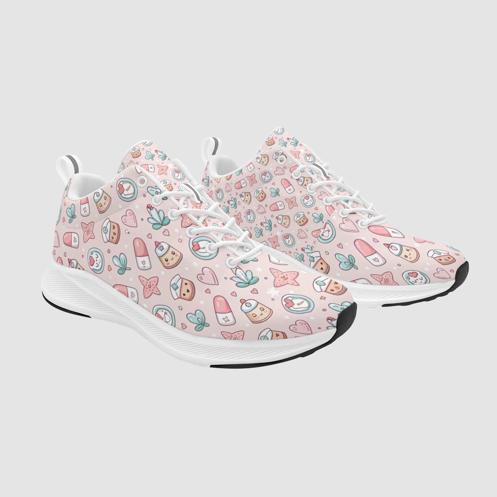Pair of women's light pink athletic sneakers featuring a cute kawaii medical pattern with pill characters and hearts, white laces, and white soles.